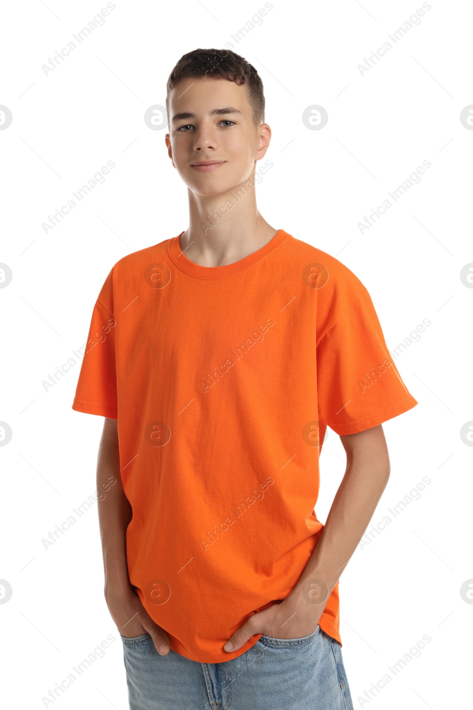 Photo of Teenage boy wearing orange t-shirt on white background