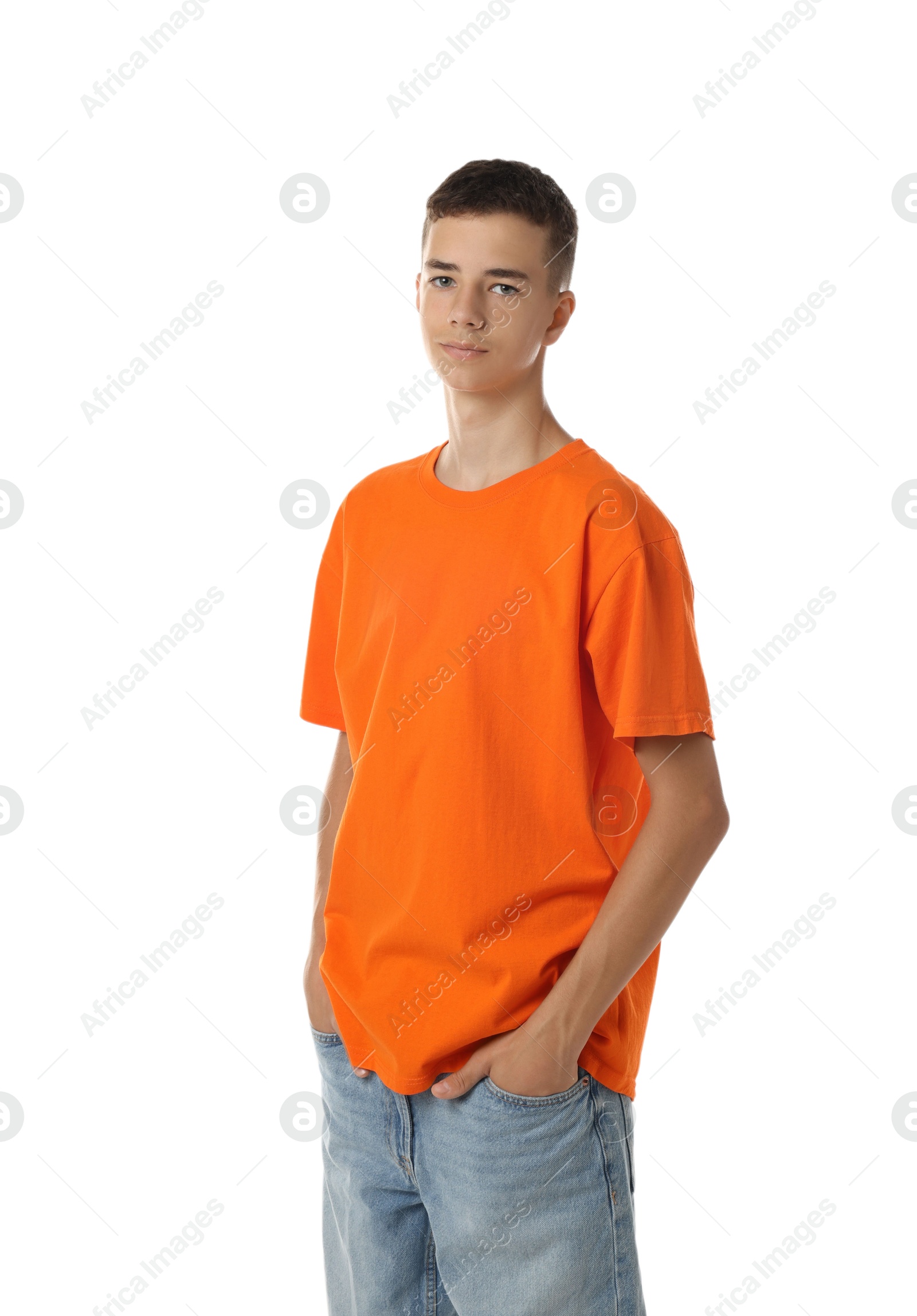 Photo of Teenage boy wearing orange t-shirt on white background