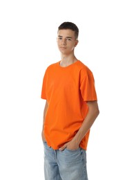 Photo of Teenage boy wearing orange t-shirt on white background