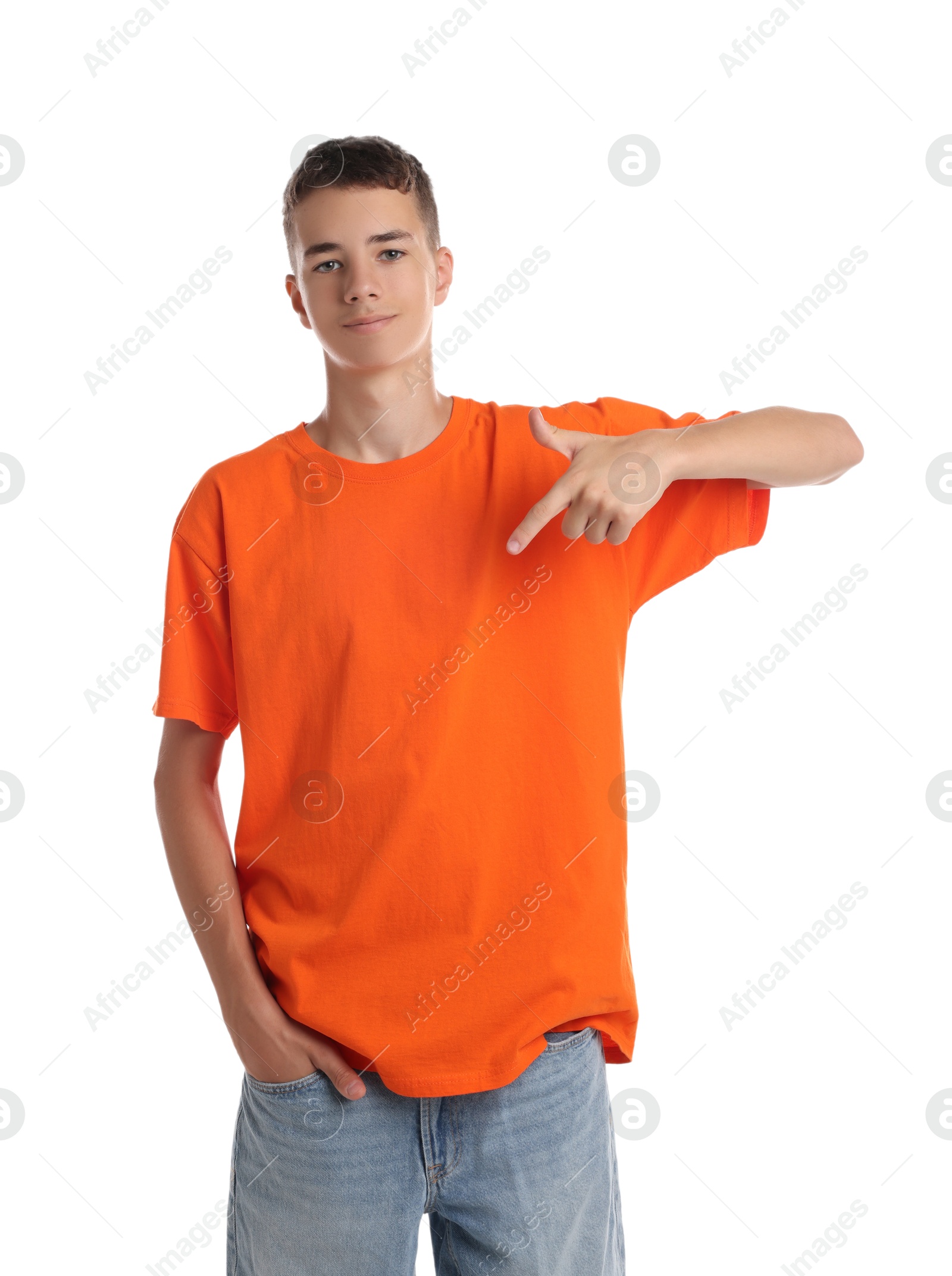 Photo of Teenage boy wearing orange t-shirt on white background