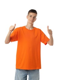 Photo of Teenage boy wearing orange t-shirt and showing thumbs up on white background