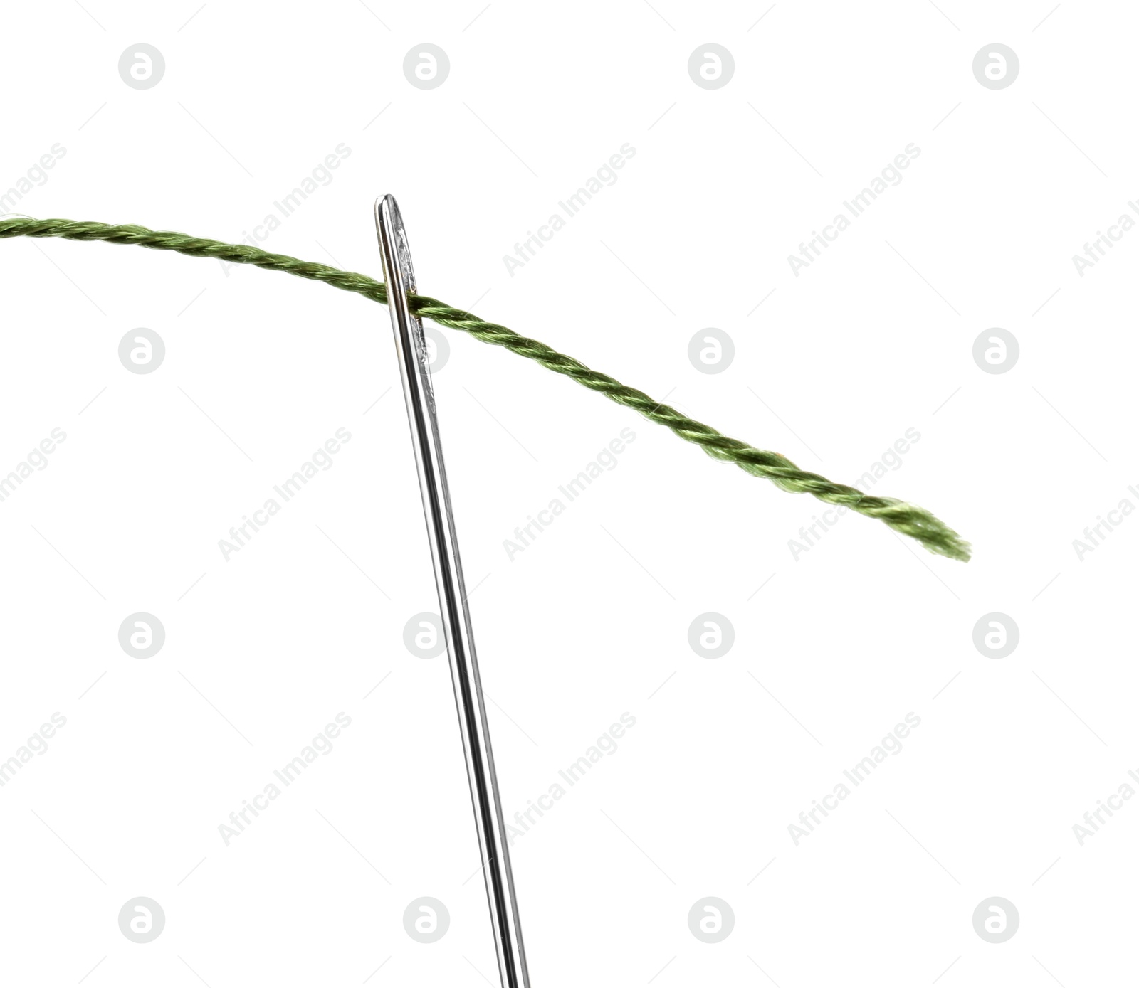 Photo of Sewing needle with green thread isolated on white