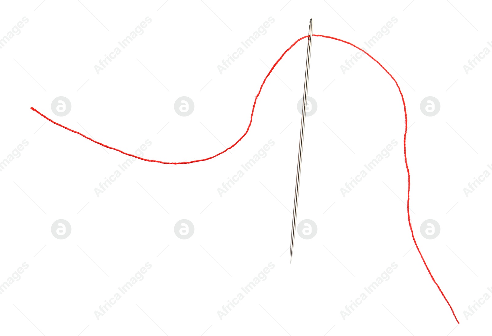 Photo of Sewing needle with red thread isolated on white