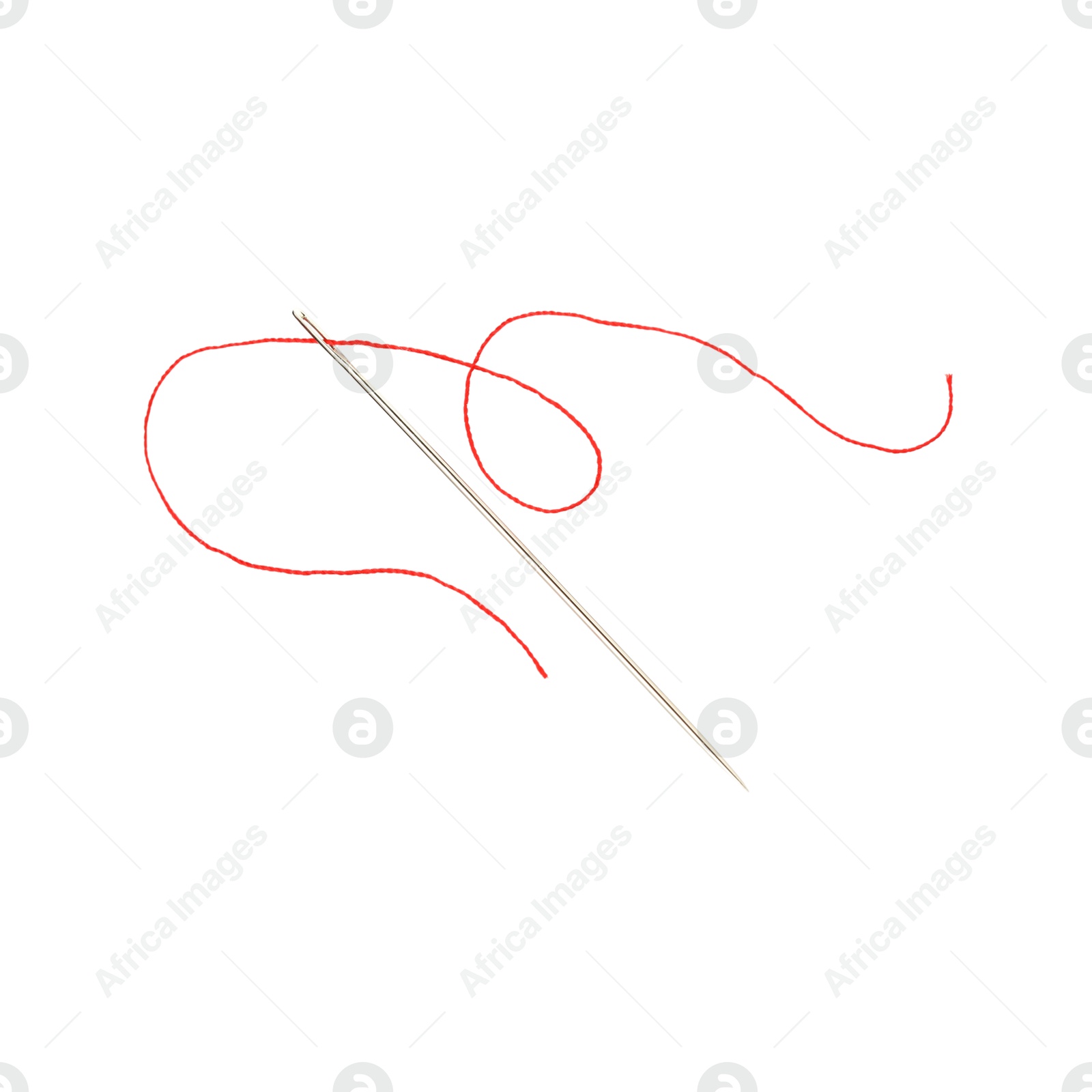 Photo of Sewing needle with red thread isolated on white