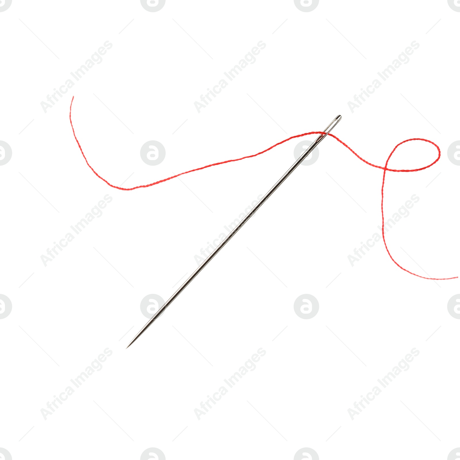 Photo of Sewing needle with red thread isolated on white