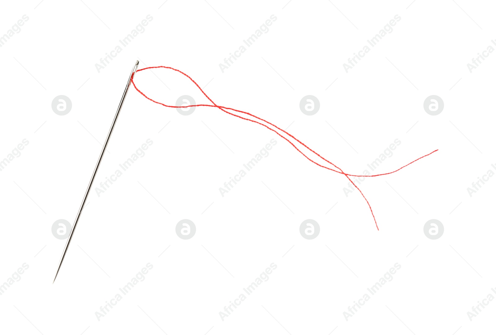 Photo of Sewing needle with red thread isolated on white