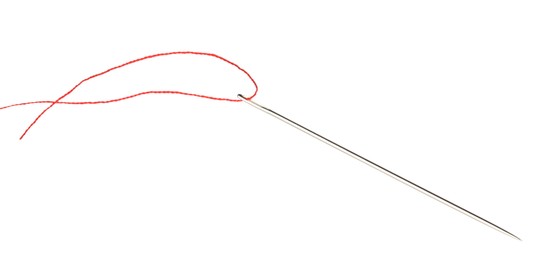 Photo of Sewing needle with red thread isolated on white