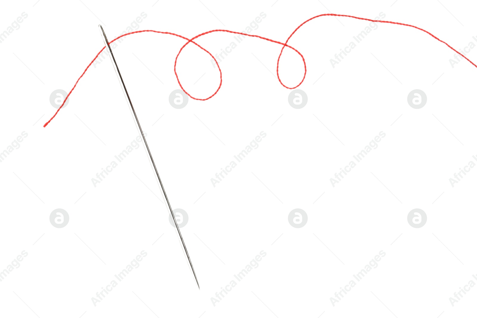 Photo of Sewing needle with red thread isolated on white