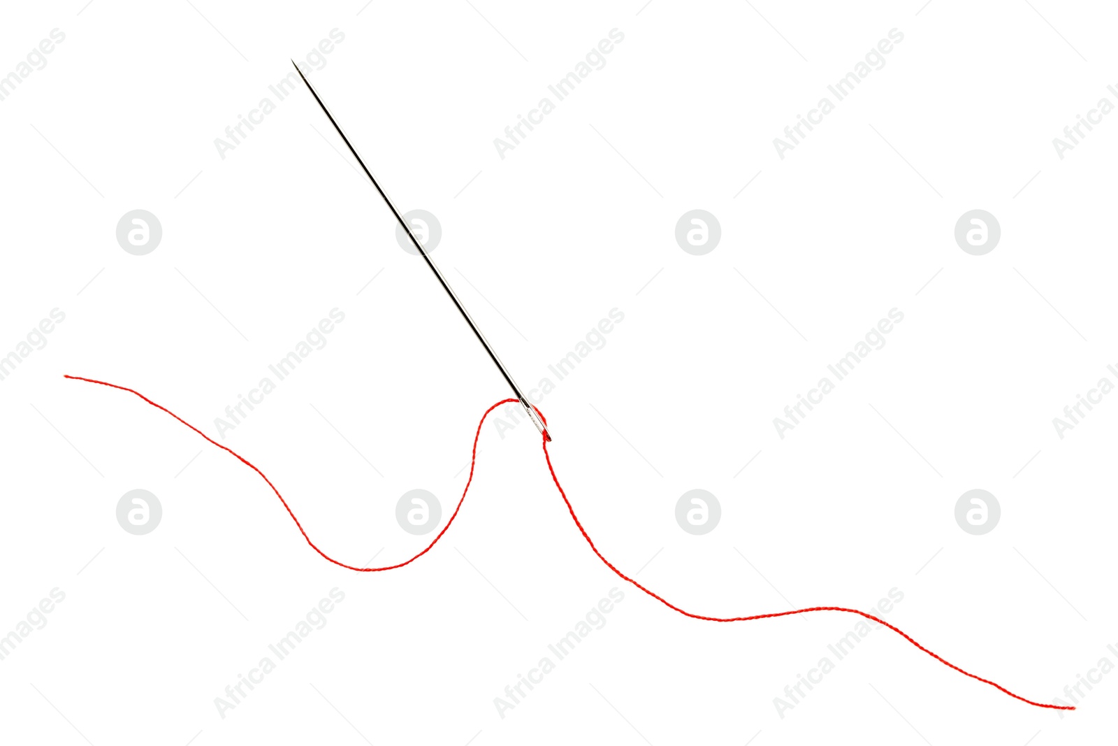 Photo of Sewing needle with red thread isolated on white