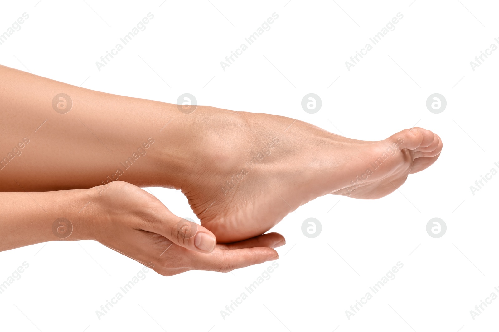 Photo of Woman touching her smooth feet on white background, closeup