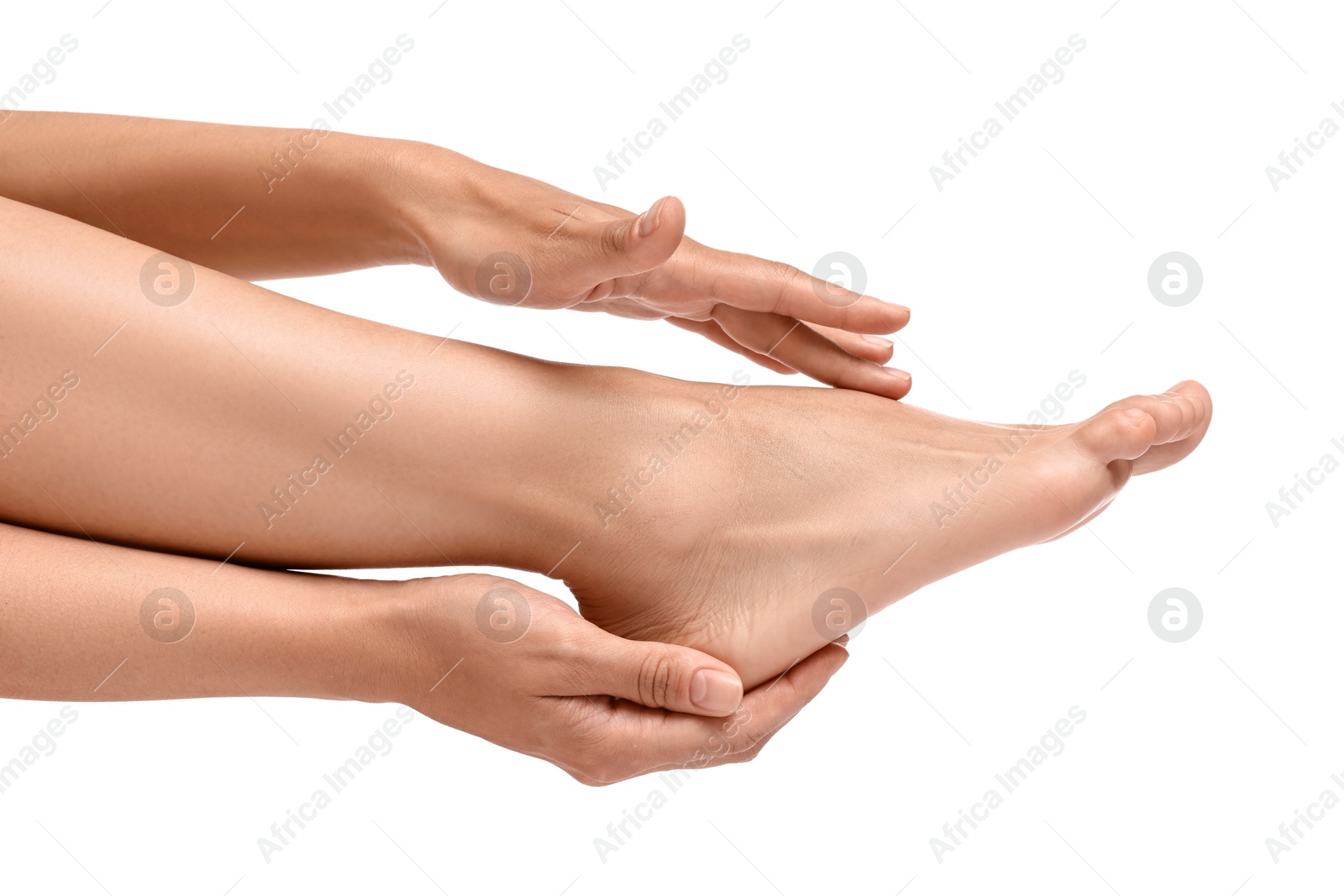 Photo of Woman touching her smooth feet on white background, closeup