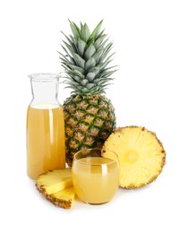 Photo of Glass with pineapple juice, jug and fresh pineapples isolated on white