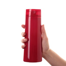 Photo of Woman with shampoo bottle on white background, closeup