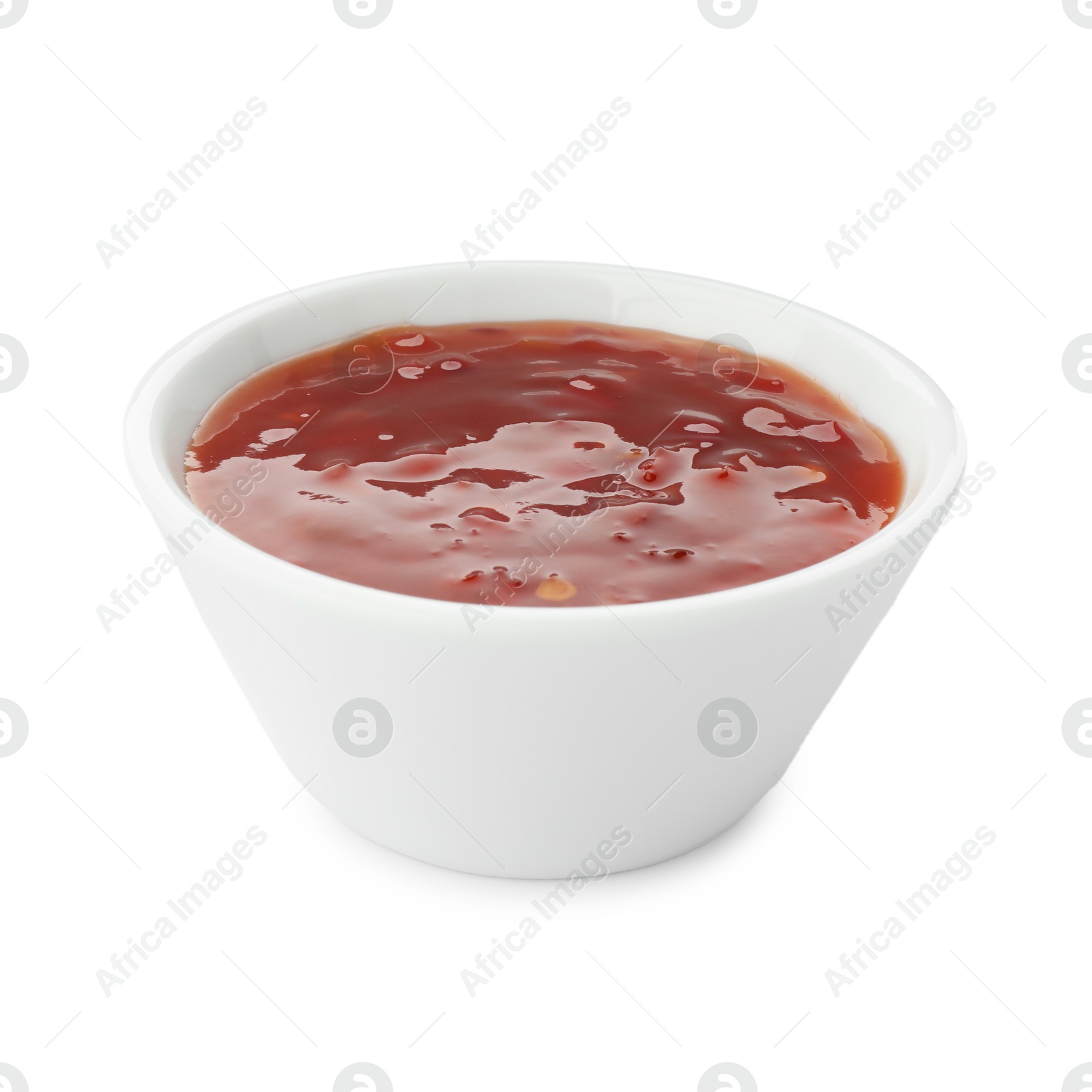 Photo of Hot chili sauce in bowl isolated on white