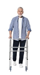 Senior man using walking frame on white background