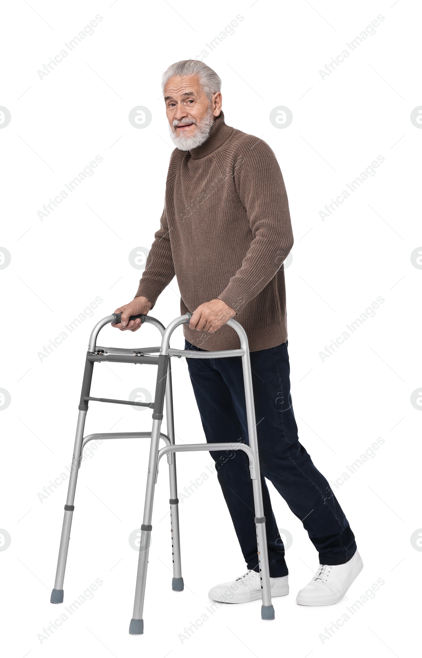 Photo of Senior man using walking frame on white background