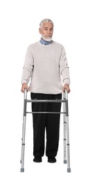 Senior man using walking frame on white background