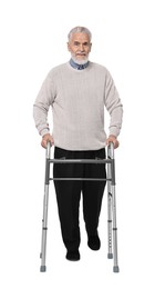 Senior man using walking frame on white background