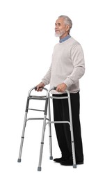 Senior man using walking frame on white background