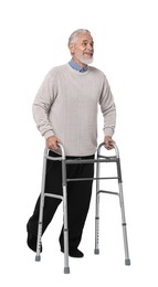 Senior man using walking frame on white background