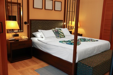 Comfortable large bed in stylish hotel room