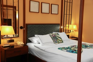 Comfortable large bed in stylish hotel room