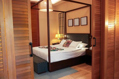 Comfortable large bed in stylish hotel room