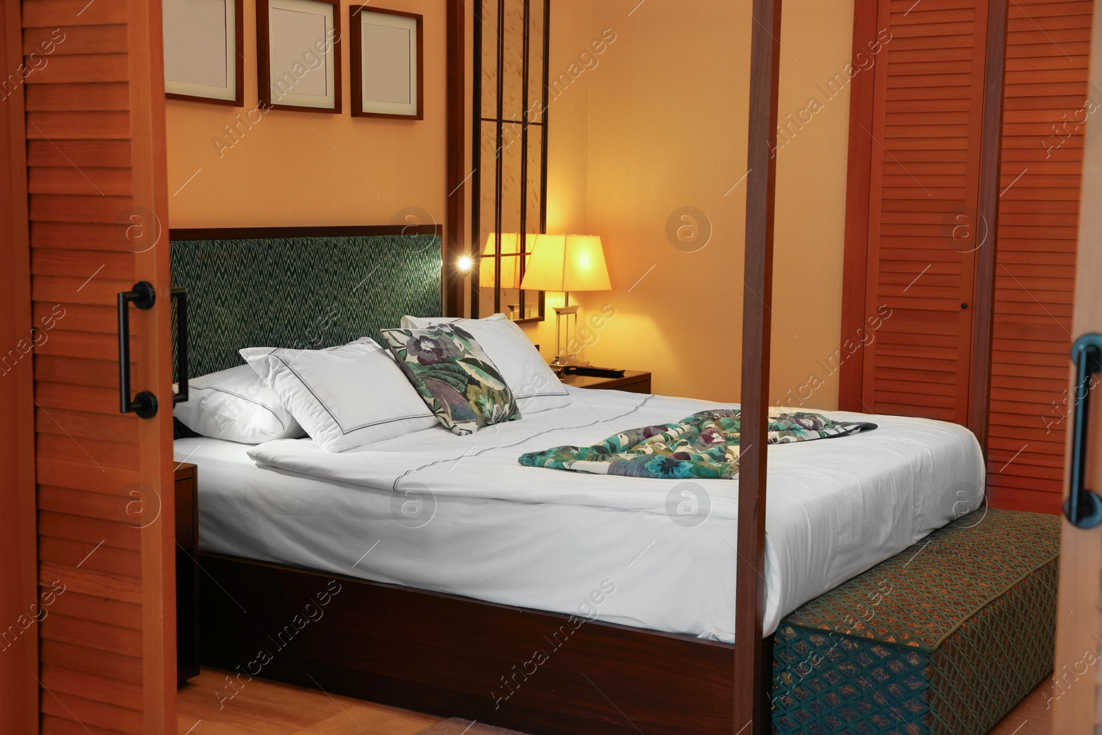 Photo of Comfortable large bed in stylish hotel room