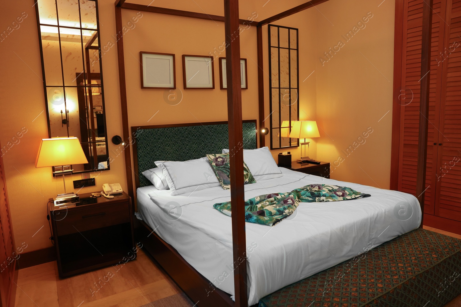 Photo of Comfortable large bed in stylish hotel room