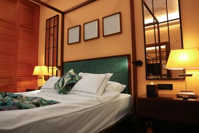 Comfortable large bed in stylish hotel room