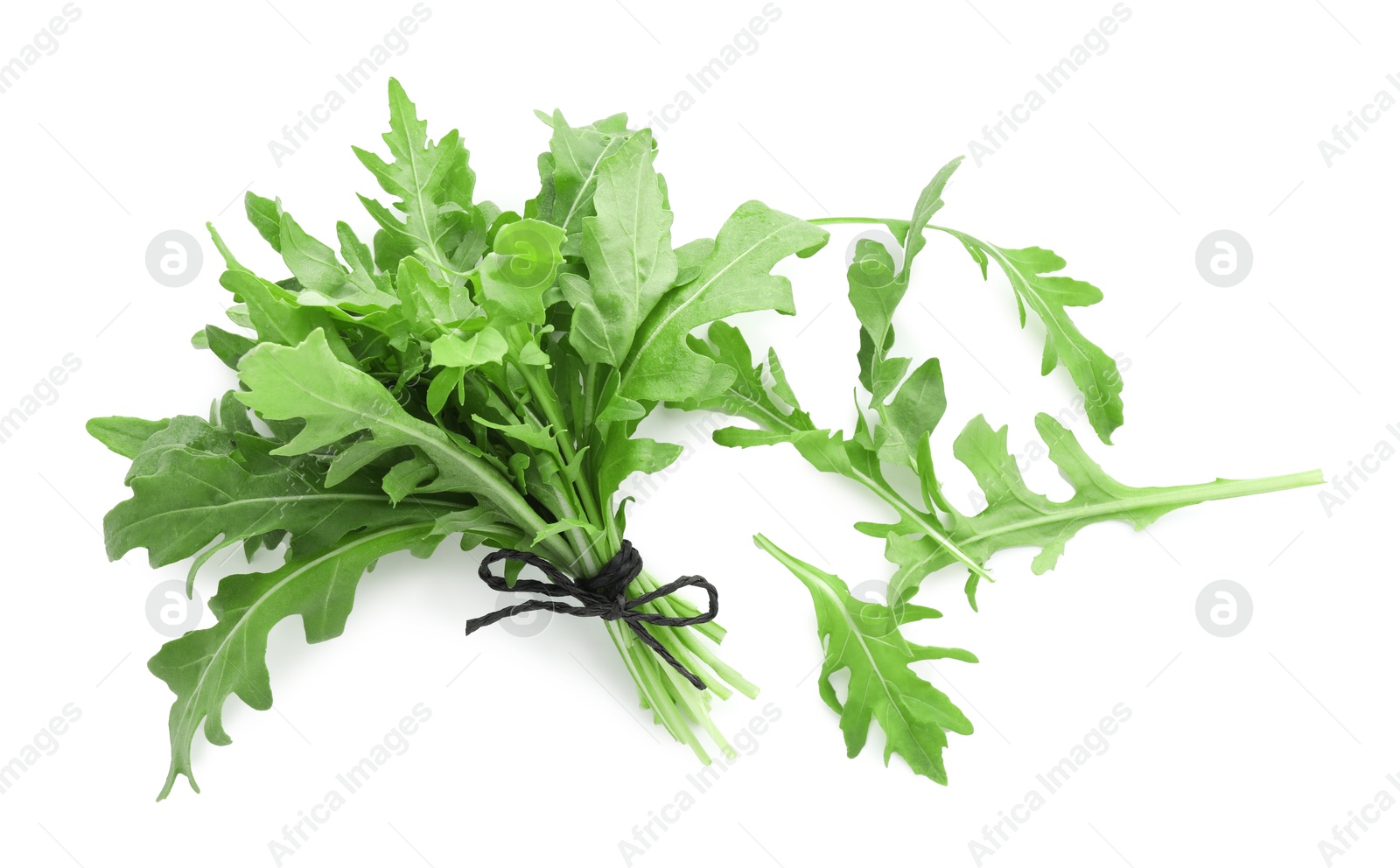 Photo of Fresh arugula leaves isolated on white, top view