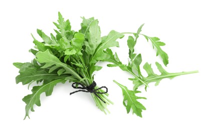 Photo of Fresh arugula leaves isolated on white, top view