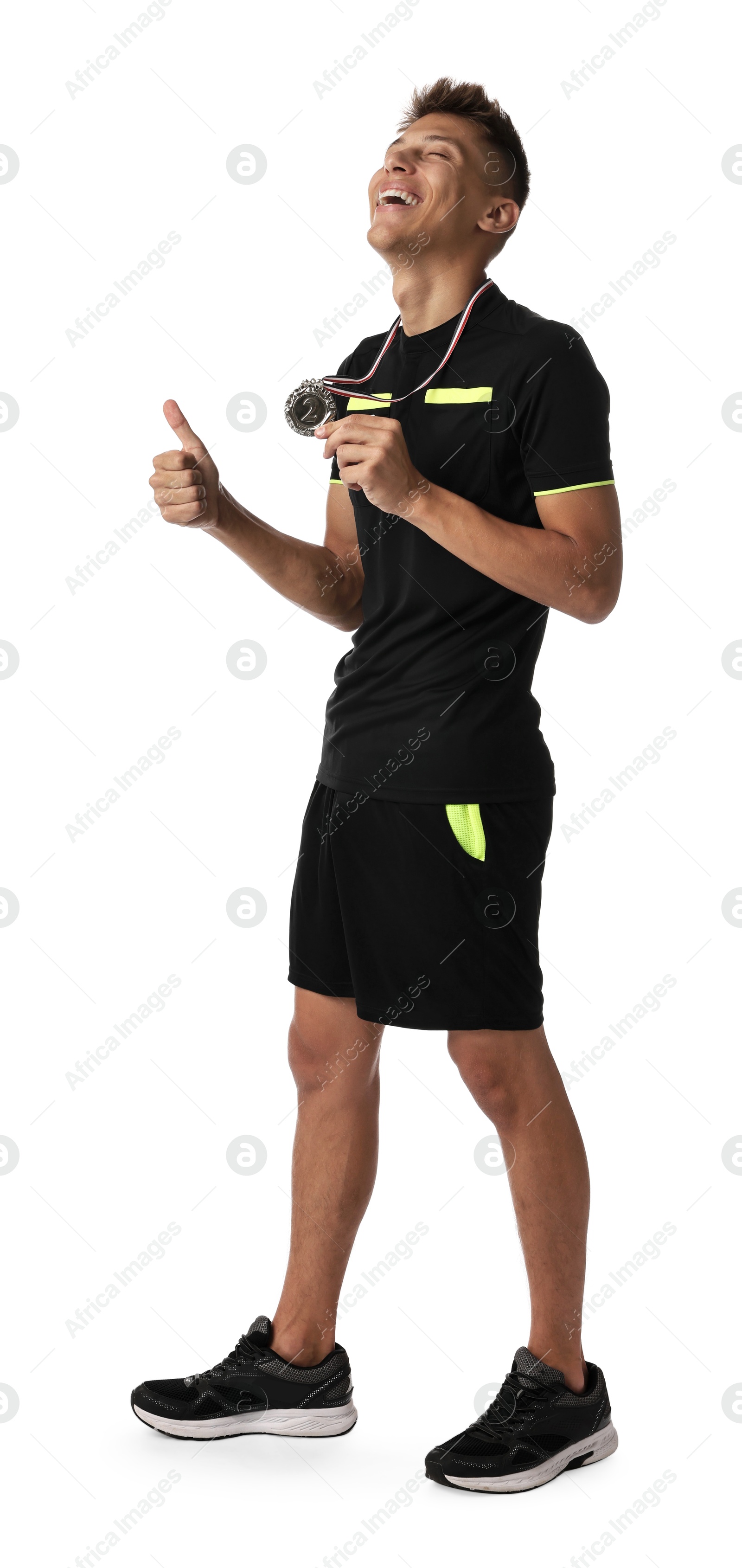 Photo of Happy winner with silver medal showing thumbs up on white background