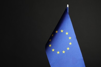 Photo of One flag of European Union on black background. Space for text