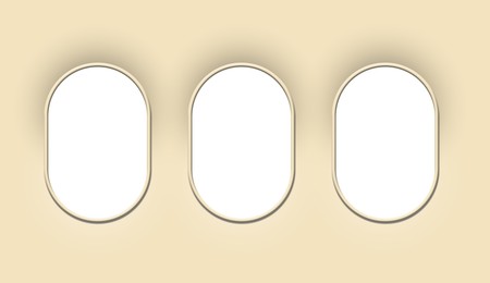 Image of Airplane windows, view from inside cabin with beige sidewall