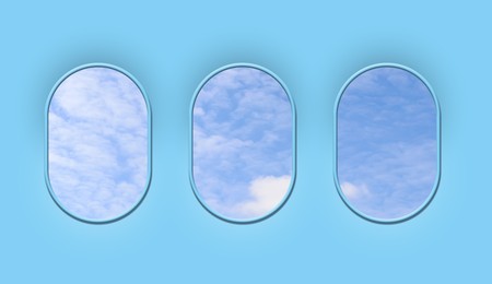 Beautiful sky with clouds, view through airplane windows in light blue sidewall of cabin