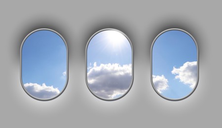 Image of Beautiful sky with clouds and sun, view through airplane windows in grey sidewall of cabin