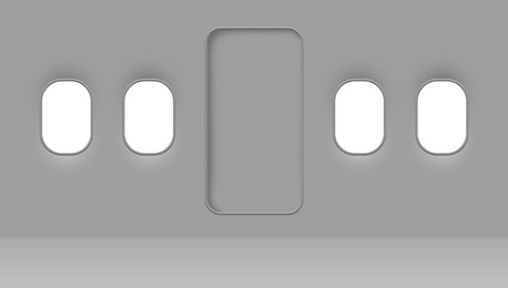 Airplane windows and door, view from inside cabin with grey sidewall