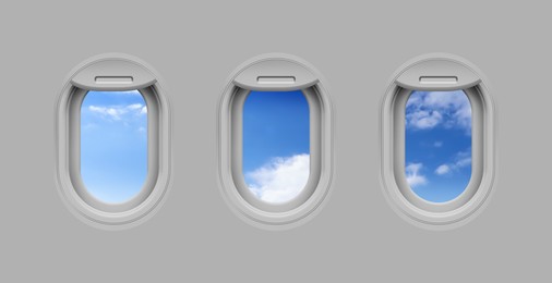 Beautiful sky with clouds, view through airplane windows in grey sidewall of cabin