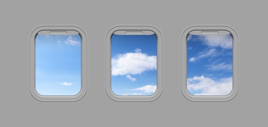 Image of Beautiful sky with clouds, view through airplane windows in grey sidewall of cabin