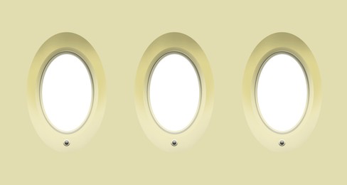 Image of Airplane windows, view from inside cabin with beige sidewall