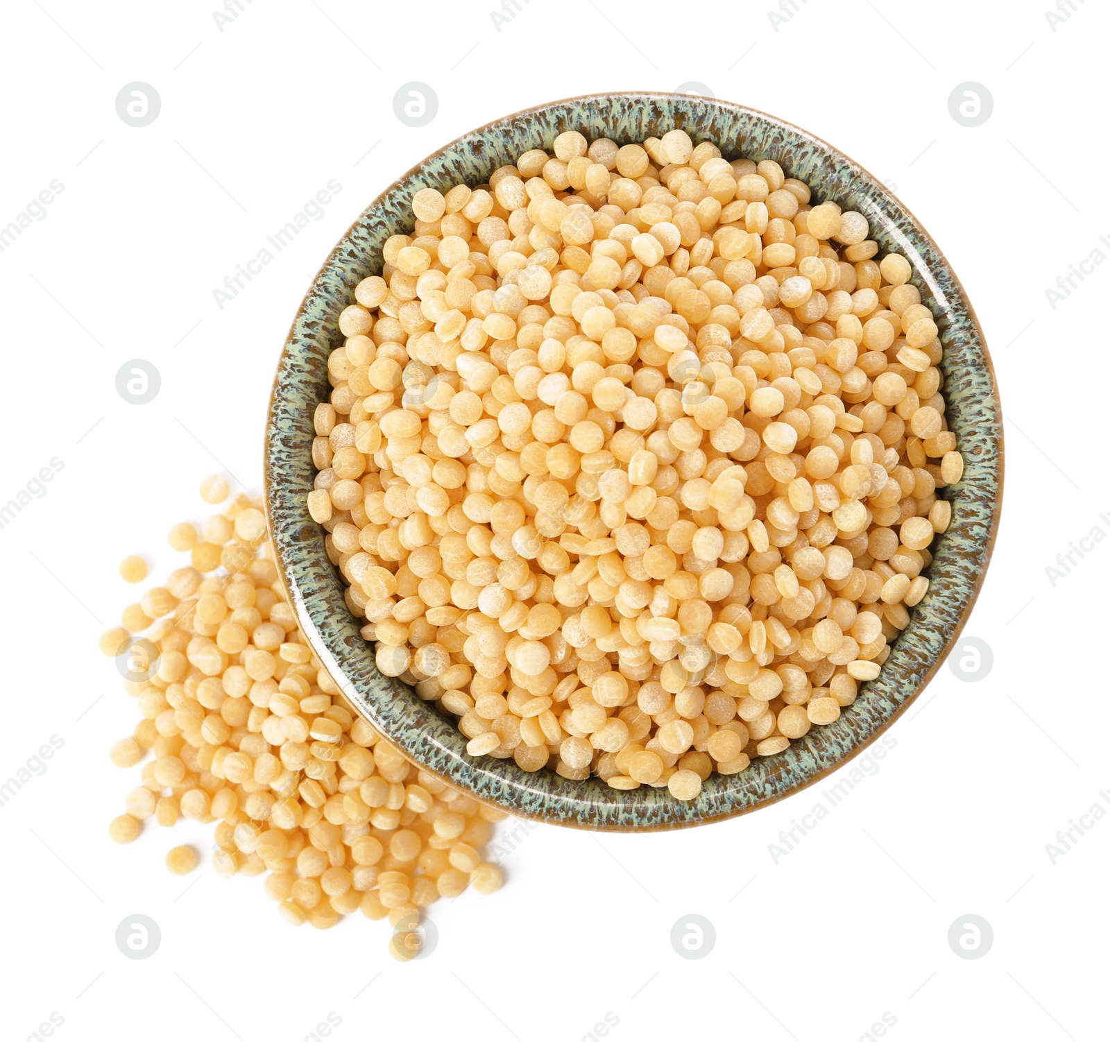 Photo of Raw couscous in bowl isolated on white, top view