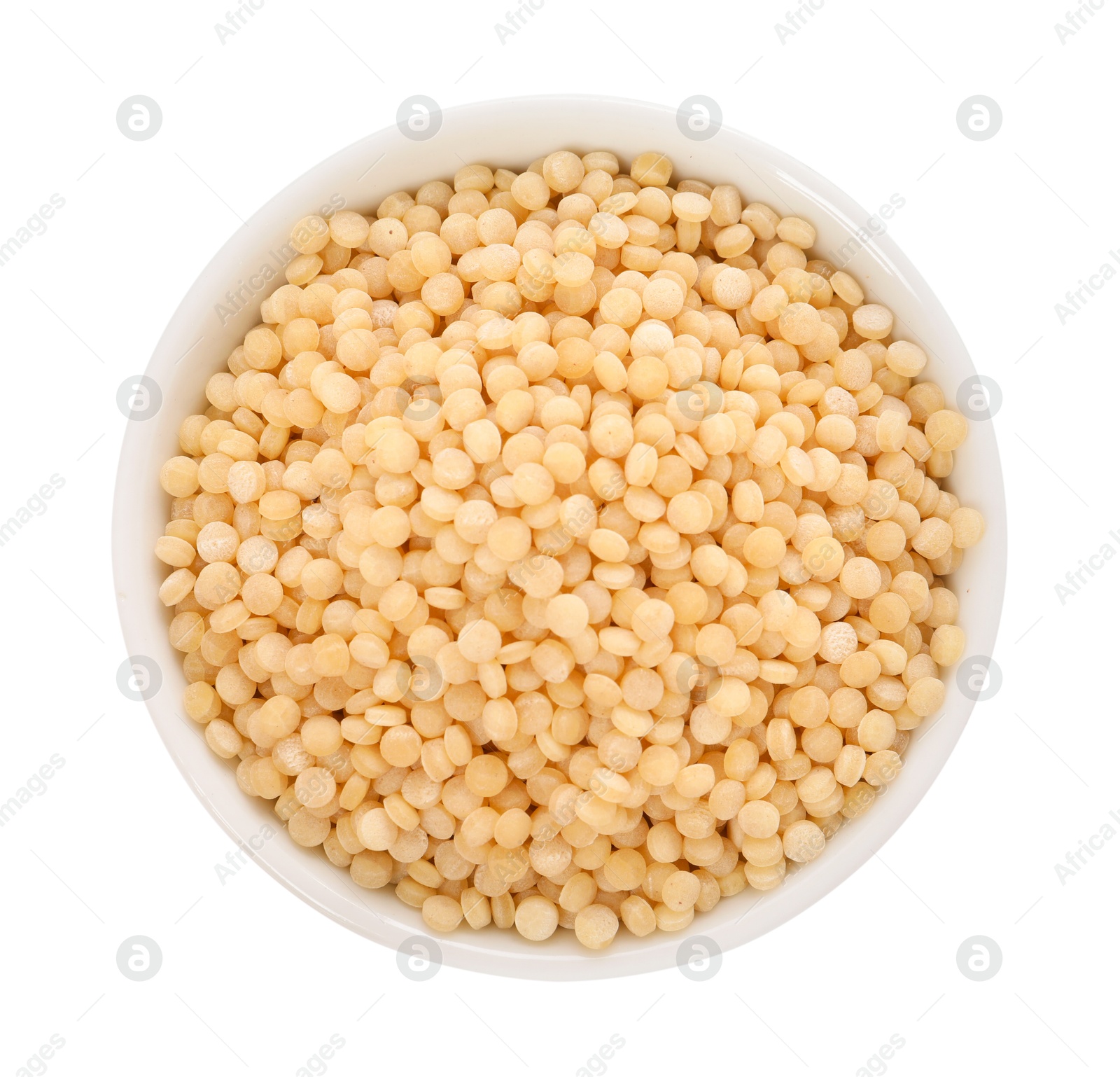 Photo of Raw couscous in bowl isolated on white, top view