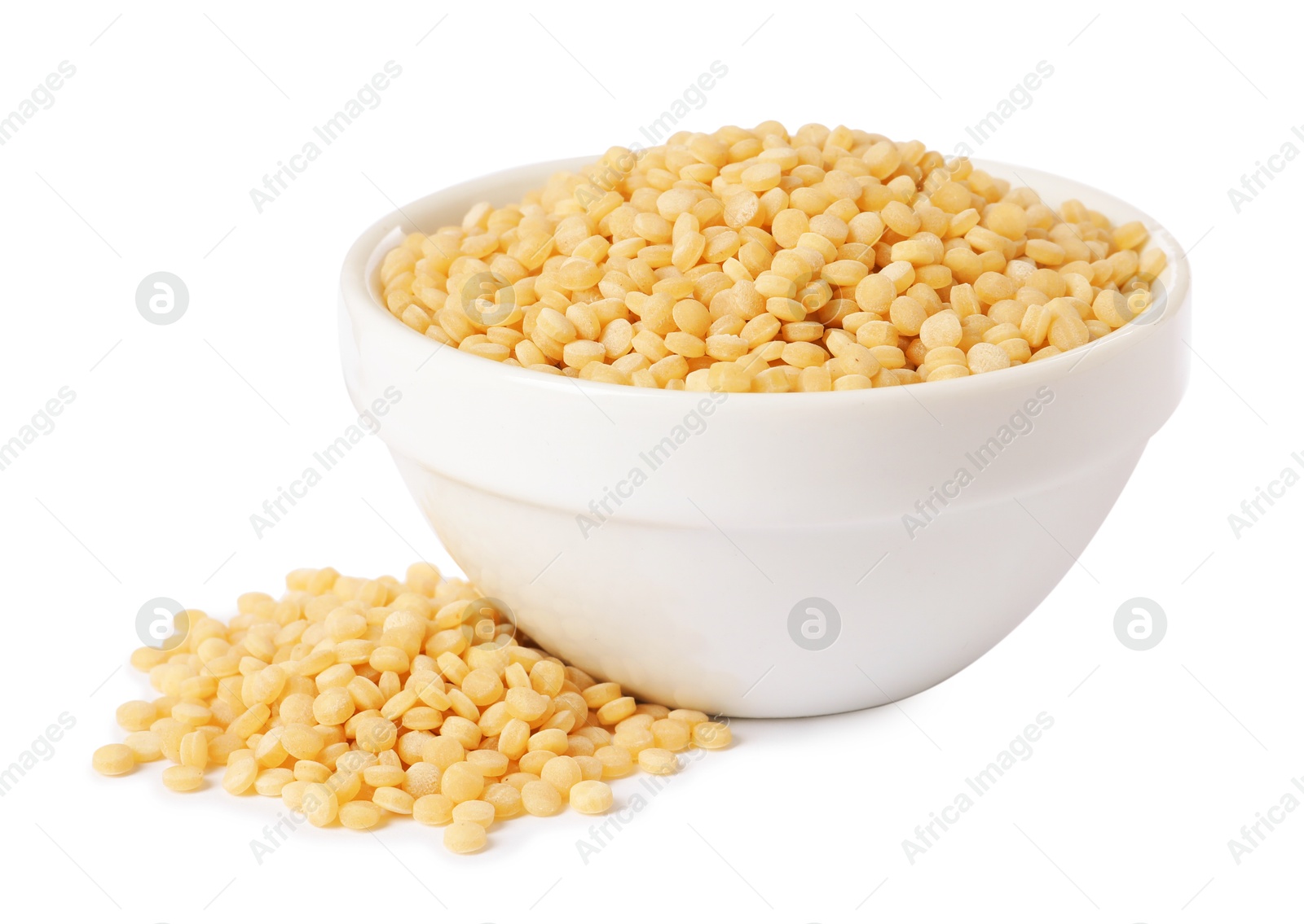 Photo of Raw couscous in bowl isolated on white