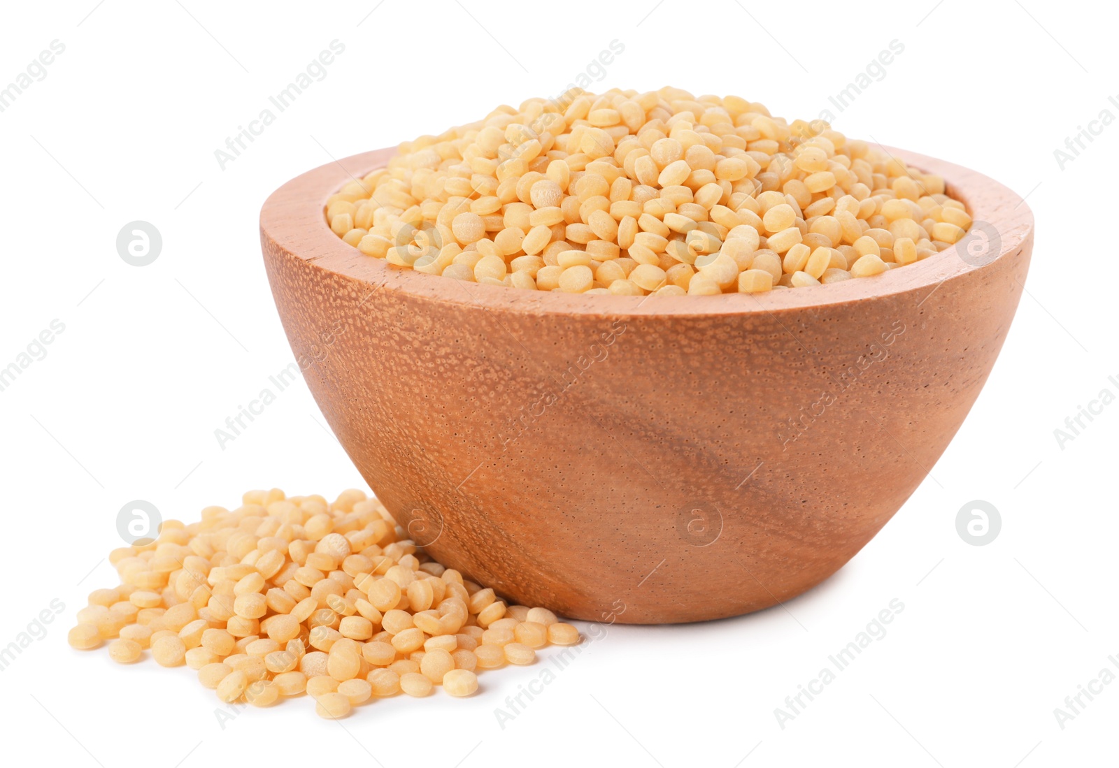 Photo of Raw couscous in wooden bowl isolated on white