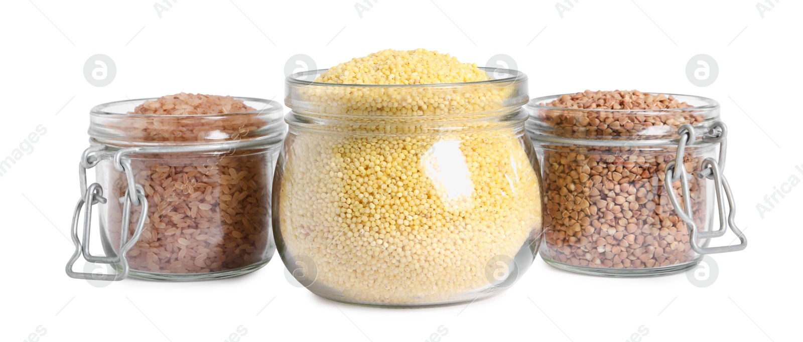 Photo of Different cereal grains in glass jars isolated on white