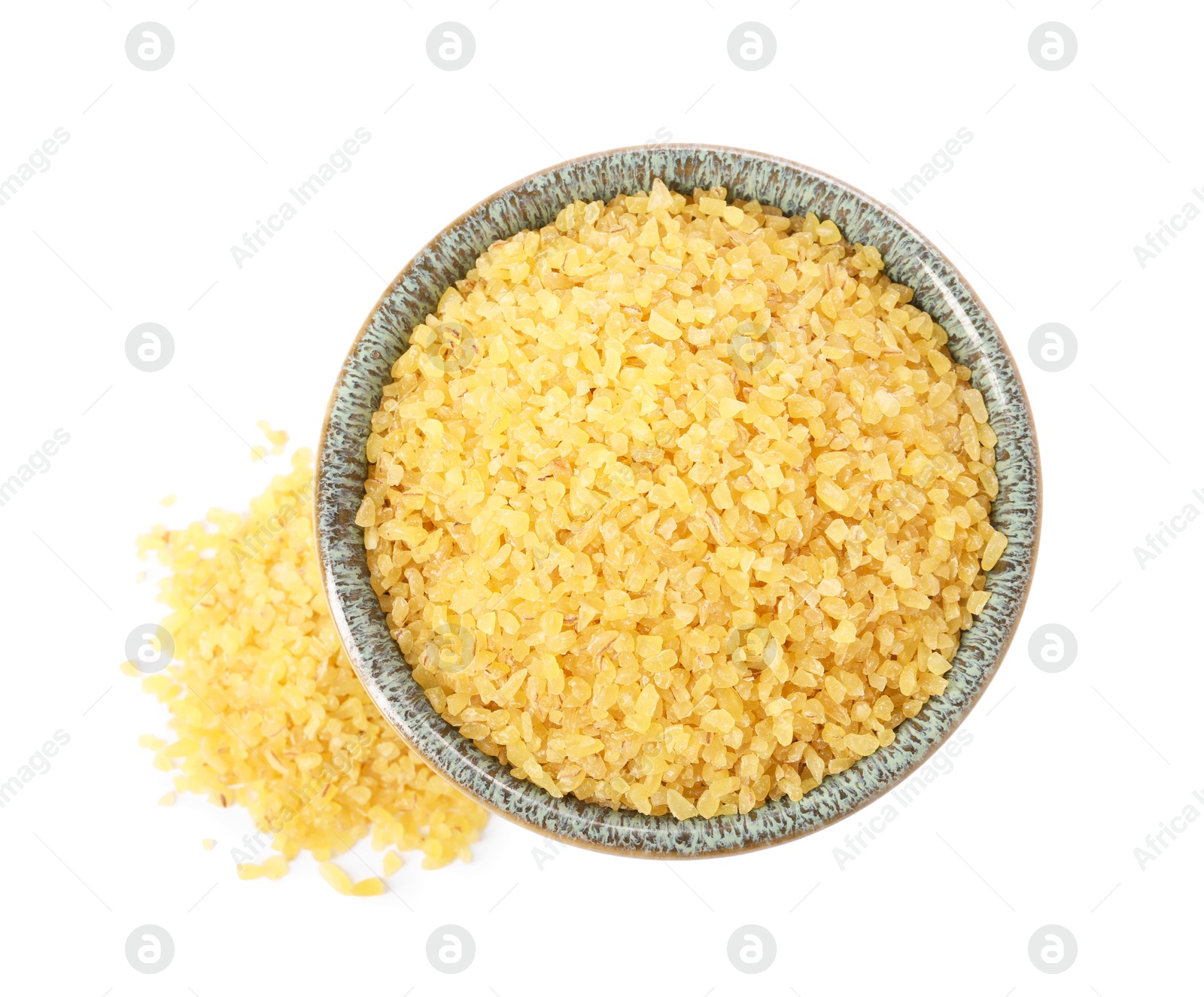 Photo of Raw bulgur in bowl isolated on white, top view