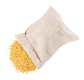 Photo of Raw bulgur and overturned burlap sack isolated on white, top view