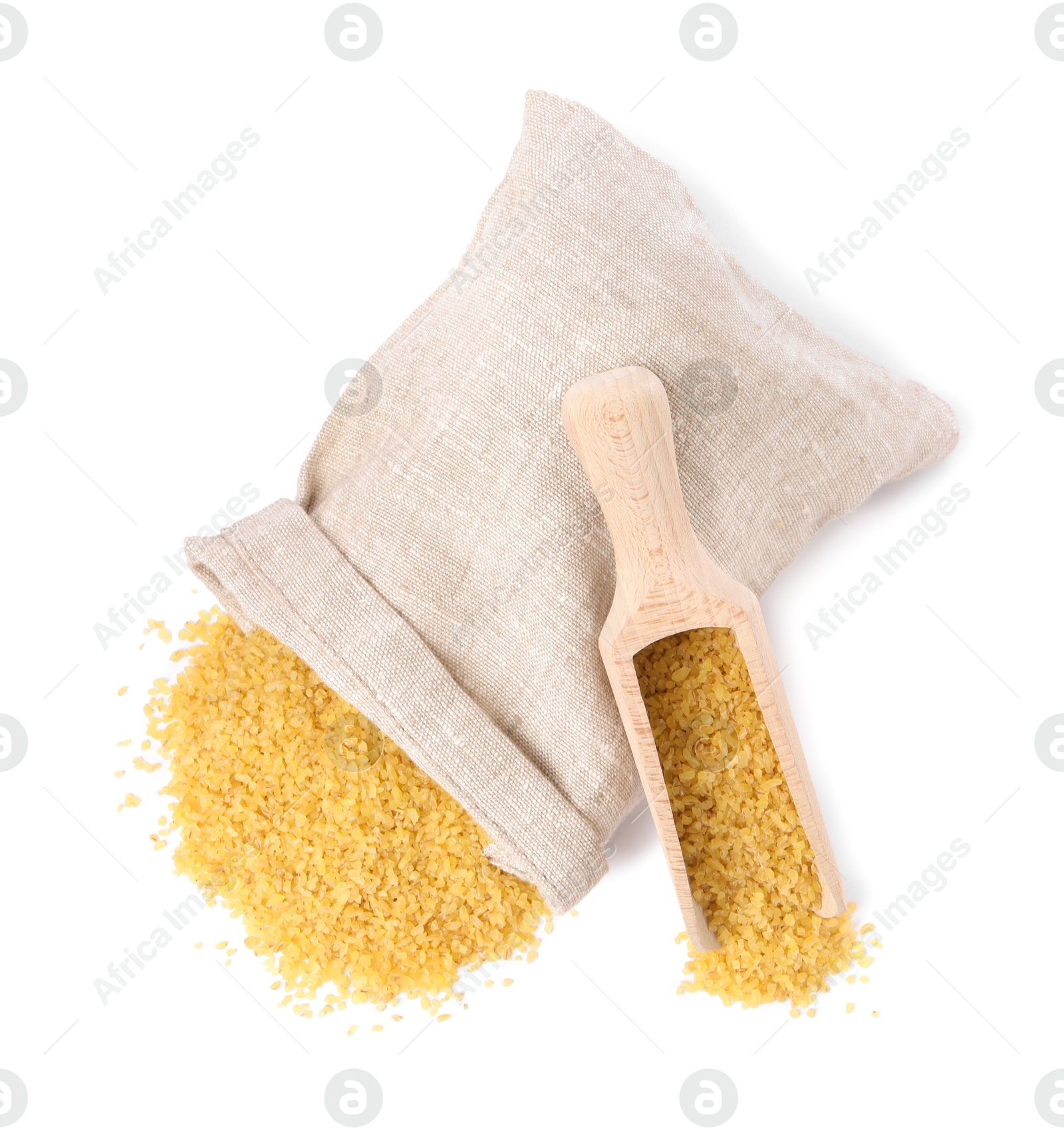 Photo of Raw bulgur, overturned burlap sack and wooden scoop isolated on white, top view