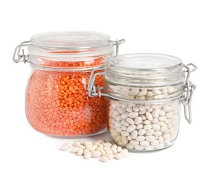 Photo of Raw beans and lentils in glass jars isolated on white